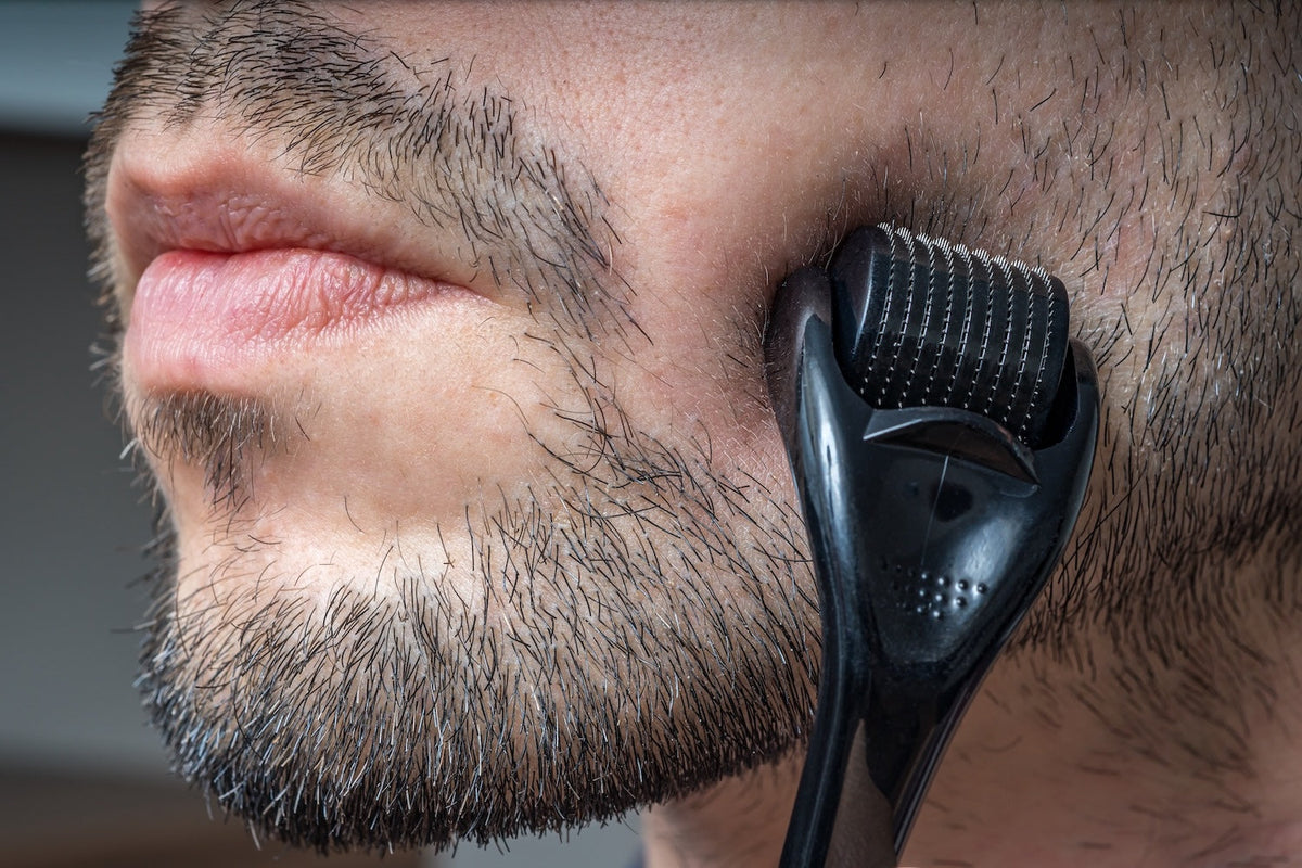do derma rollers work for beard growth – close-up of roller on patchy beard
