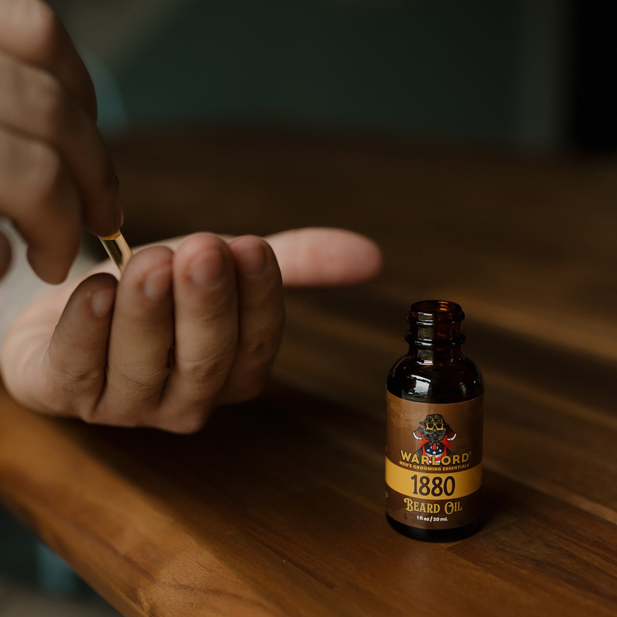 Bottle of Warlord Beard Oil placed on a rustic wood surface